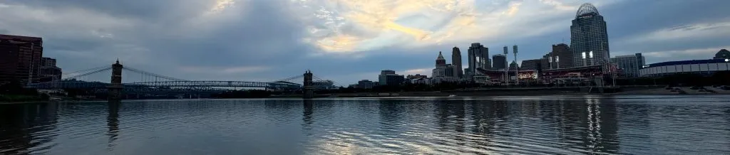 View of Ohio River with Roebling Bridge with Cincinnati skyline in background